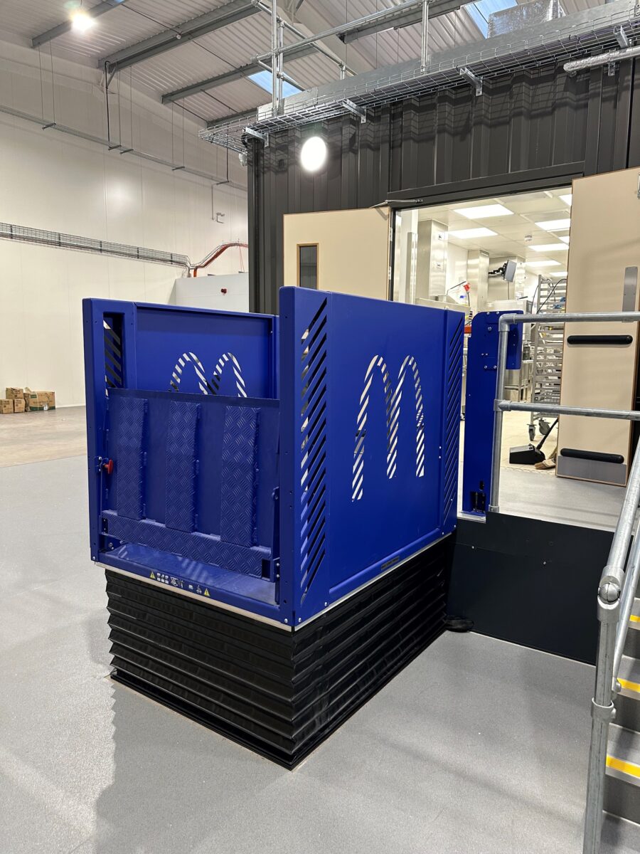 A blue MCL low rise lift in a warehouse